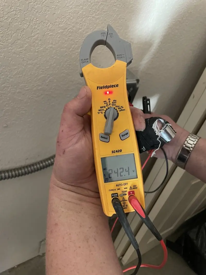 Voltage testing with clamp meter during Electrical Installation Services in Coeymans